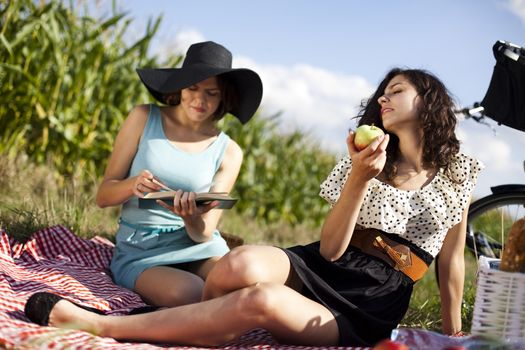 Young women on nature picnic