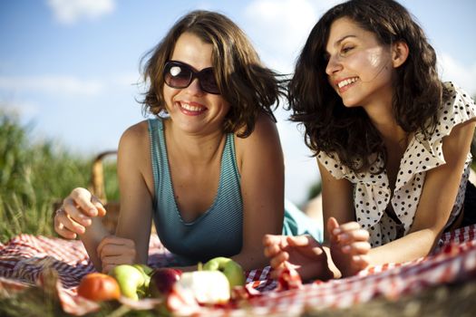 Young women on nature picnic