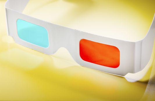 Disposable cardboard 3D Anaglyph glasses with cyan/red lenses.