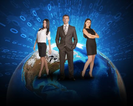 Three business person standing on Earth surface. Background is world map with ray of figures. Elements of this image furnished by NASA