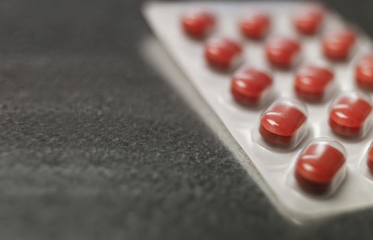 Blister pack of Red medicine pills Close up