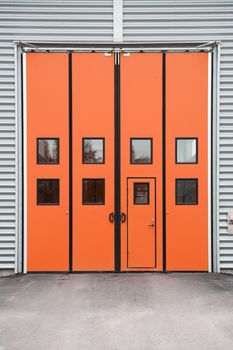 Orange Garage Door on a warehouse building