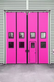 Pink Garage Door on a warehouse building