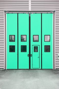 Green Garage Door on a warehouse building