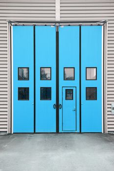 Blue Garage Door on a warehouse building