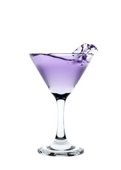 Purple liquid splashing in a martini glass isolated on white background