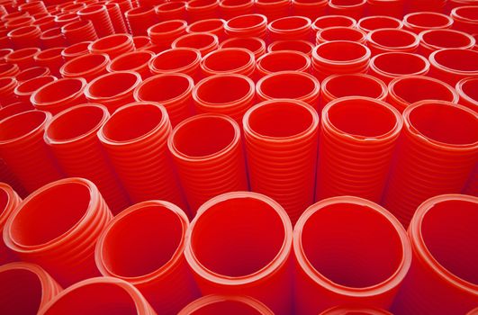 Large Group of Red Industrial Plastic Pipes Full Frame