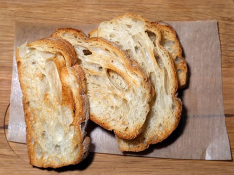 delicious sliced bread on wooden table