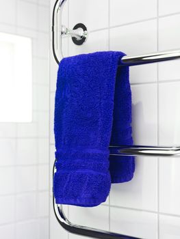 Blue Towel on a dryer in modern bathroom environment