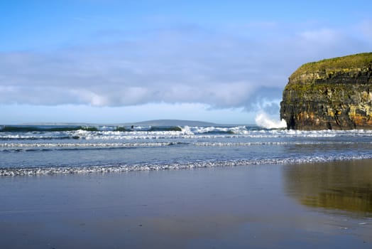 wild atlantic way waves crashing against the cliffs in Ballybunion Ireland