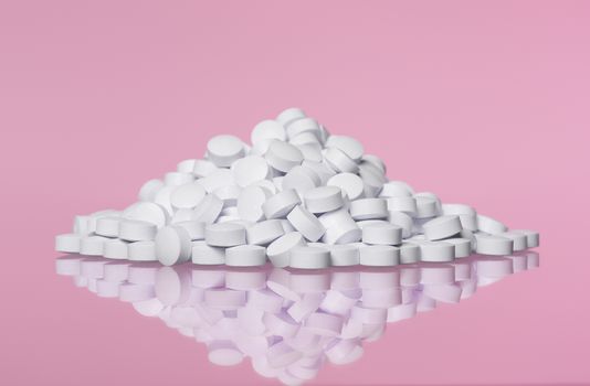 Stack of pills towards pink background