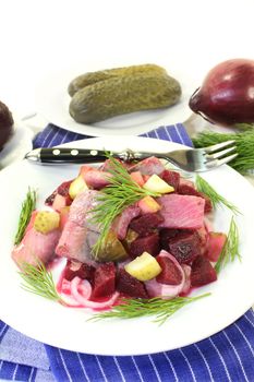 Matie salad with beetroot, onions and pickles