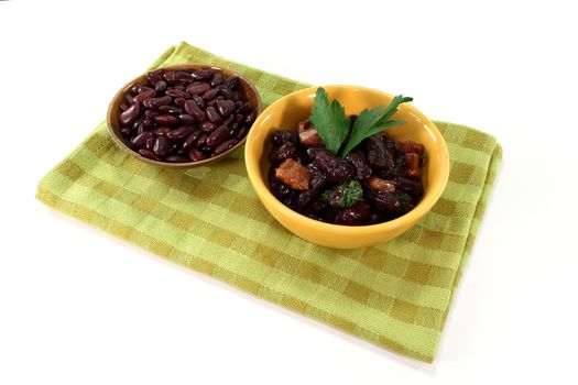 Kidney beans with fried bacon and fresh parsley