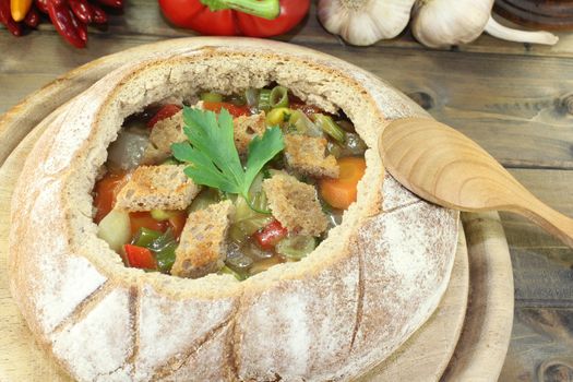 Bread soup with garlic, parsley, greens and croutons