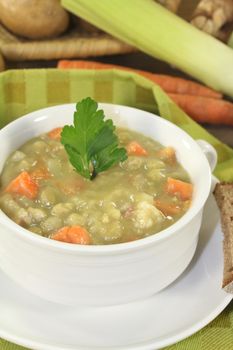 delicious hearty pea soup with carrots and parsley