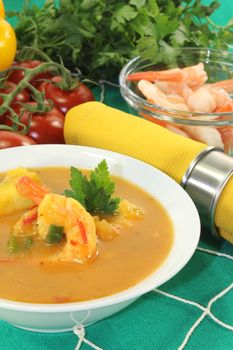 exotic Curry soup with shrimp on a fishing net
