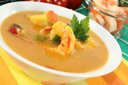 hot exotic Curry soup with shrimp on a fishing net