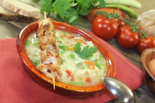 Chicken soup with greens, parsley and noodles