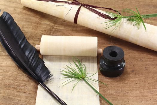 Papyrus scroll with plant, quill and inkwell