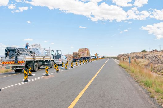 BEAUFORT WEST, SOUTH AFRICA - DECEMBER 1, 2014: A typical sight on South African Roads - stop and go delays at road works
