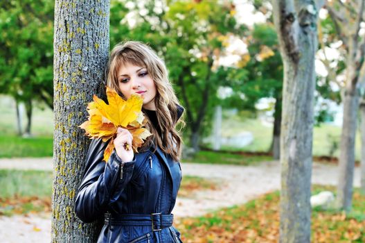 tender teen girl in the autumn park