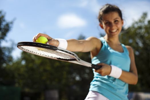 Girl playing tennis on the court