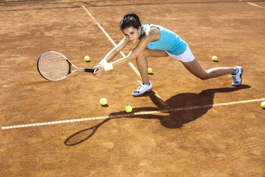 Woman playing tennis in summer