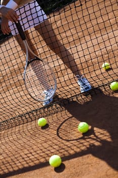 Young woman playing tennis, summertime saturated theme