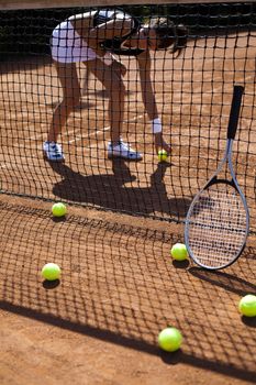 Young woman playing tennis, summertime saturated theme