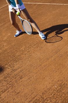 Girl playing tennis on the court