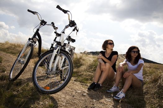 Woman riding bicycle, summer free time spending