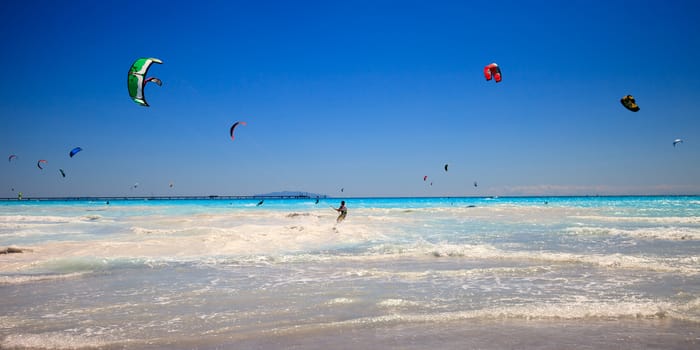 Kitesurfers in the beach of Rosignano, Italy