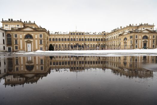 The historic Villa Reale of Monza reflected on a during a cold winter day, Milan, Italy