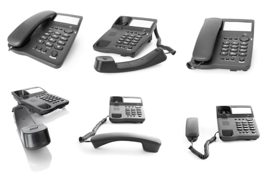 Collection of black office phones isolated on white