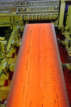 hot steel on conveyor inside of plant