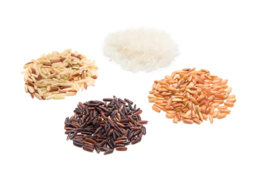 piles of brown and white variety rice on white background