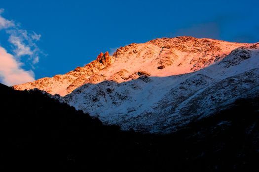 Sunlight in the evening touch top mountain peak