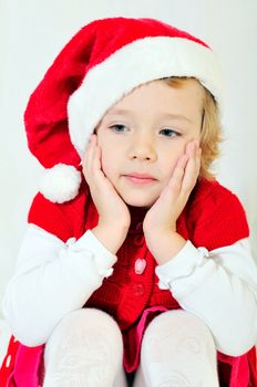 studio shoot of thoughtful santa helper girl 