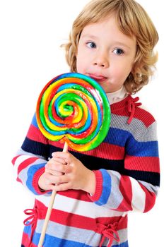 little girl eating big colorful lollipop