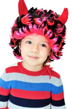 Portrait of funny little girl wearing devil's horns 