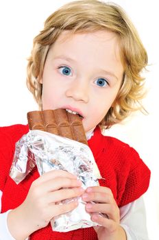 little girl eating big chocolate bar