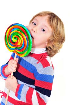 little girl eating big colorful lollipop 