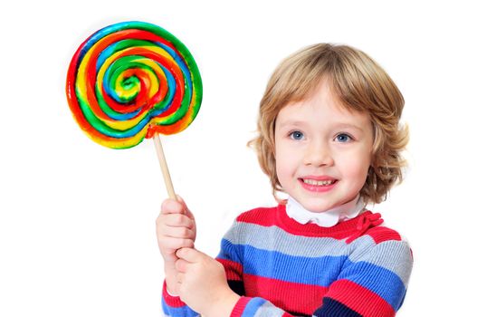 little girl holding big colorful lollipop 