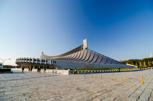 Tokyo, Japan - November 20, 2013: People visit Yoyogi National Gymnasium on November 20, 2013 Yoyogi National Gymnasium is an arena in Yoyogi Park, Tokyo, Japan which is famous for its suspension roof design.