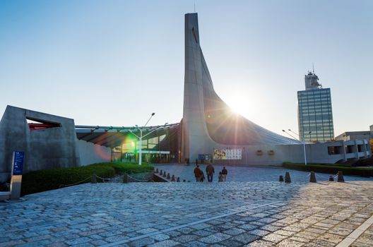 Tokyo, Japan - November 20, 2013: Japanese People visit Yoyogi National Gymnasium on November 20, 2013 Yoyogi National Gymnasium is an arena in Yoyogi Park, Tokyo, Japan which is famous for its suspension roof design.