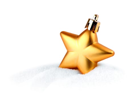 Golden Christmas decoration star in white snow isolated