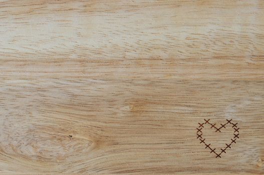 wooden background with heart on it