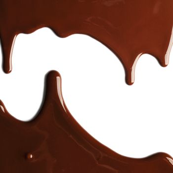 Hot melted chocolate pouring on the white background
