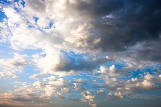 Blue sky with lots of white and gray clouds