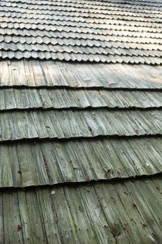 Old wooden shingle roof. Wooden surface texture.